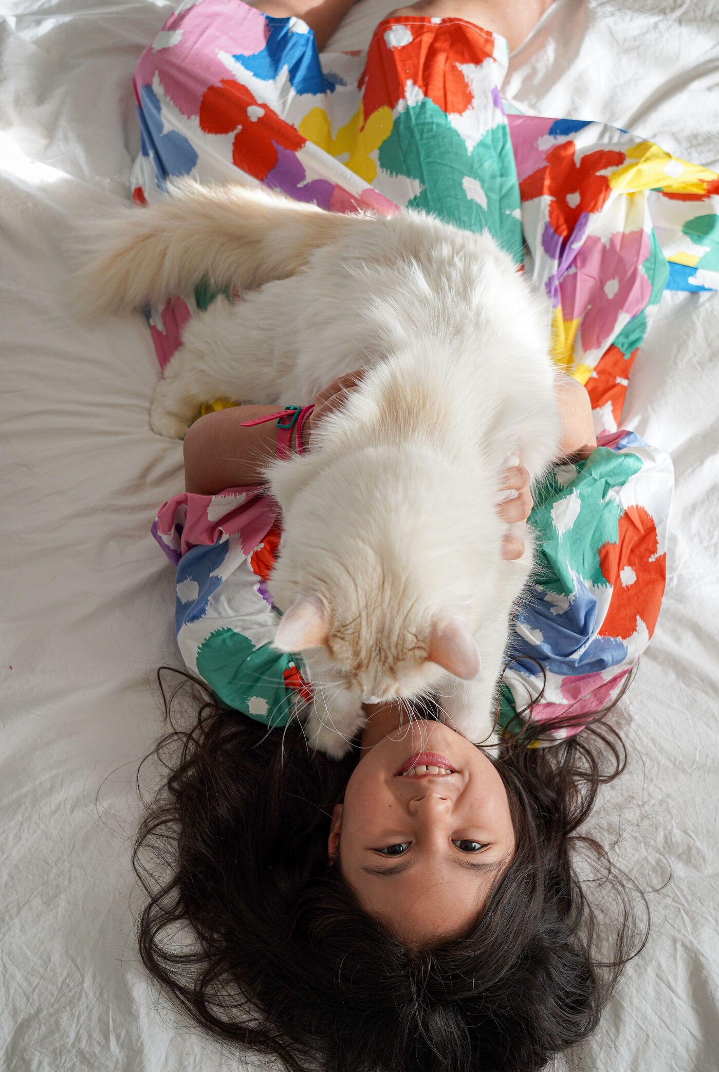 Haiyan and Luciano’s daughter Chloe with their cat Orsetto