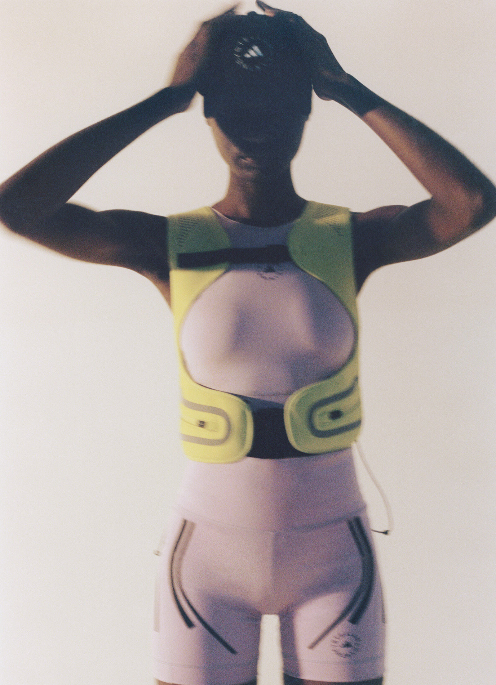 Model, standing, wears adidas by Stella McCartney lilac sports bra and shorts  Model, standing, wears adidas by Stella McCartney lilac sports bra and shorts