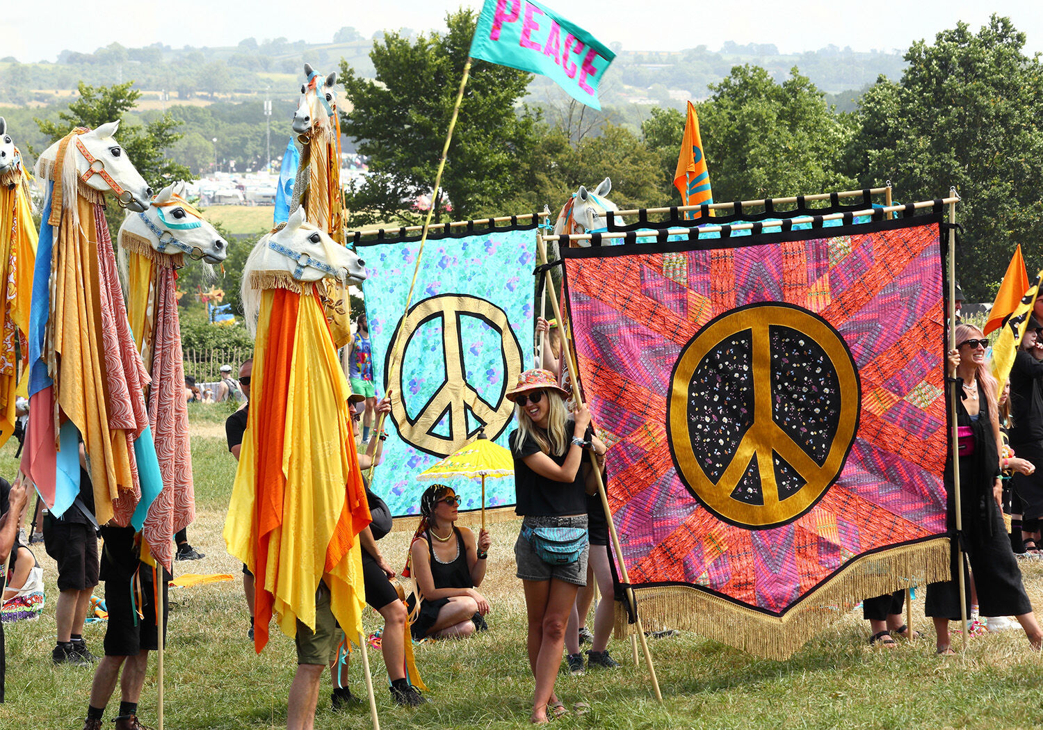 Glastonbury 2023 peace procession, with banners created from upcycled Stella McCartney fabrics.  Glastonbury 2023 peace procession, with banners created from upcycled Stella McCartney fabrics.