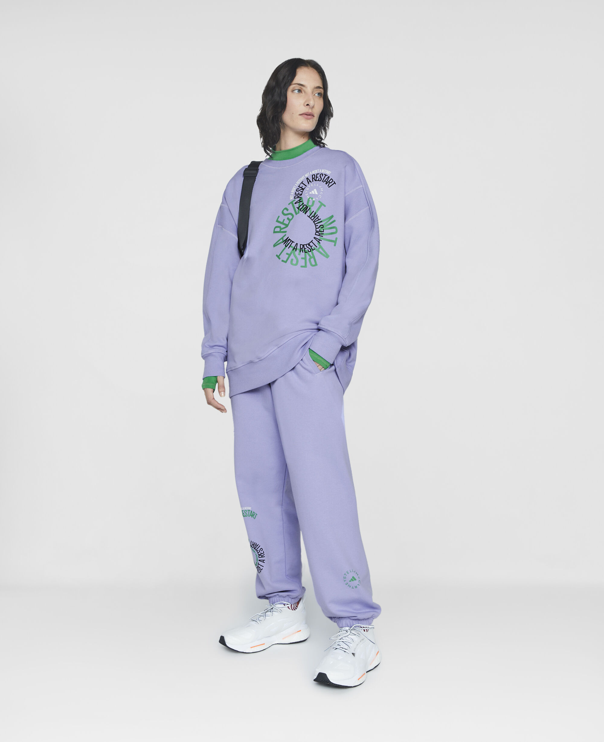 Women Faded Glow Purple Unisex Graphic Logo Sweatshirt Stella