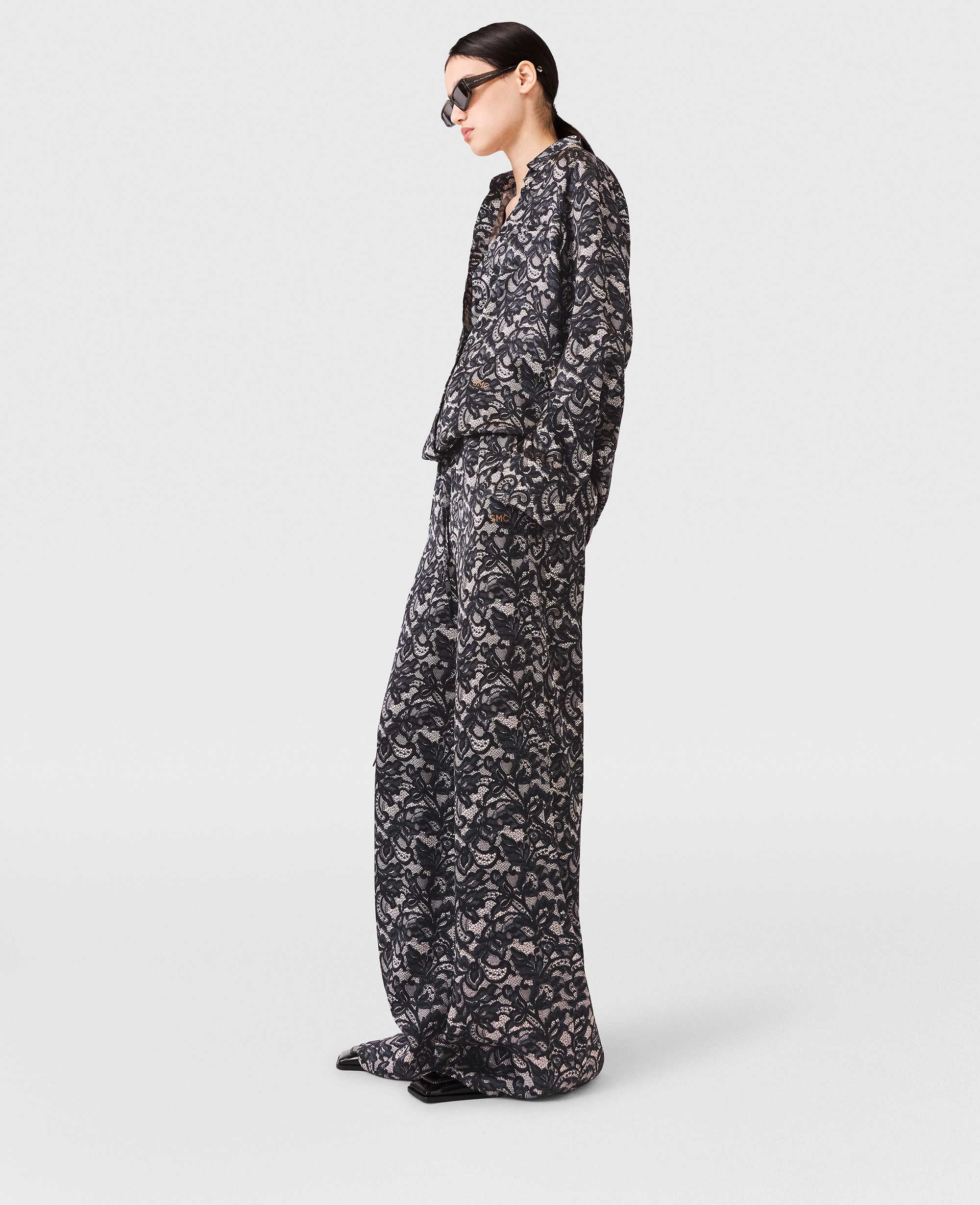 Stella Mccartney Lace Print Oversized Drawstring Trousers In Black